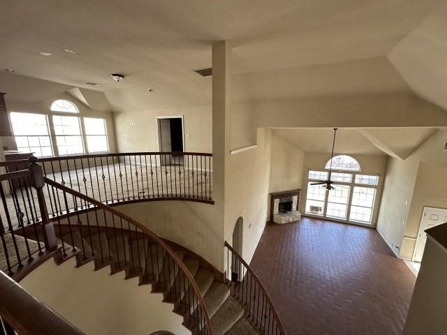 stairway featuring lofted ceiling