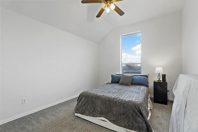 carpeted bedroom featuring ceiling fan and vaulted ceiling