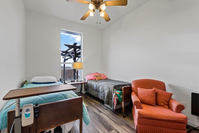 bedroom featuring hardwood / wood-style flooring and ceiling fan