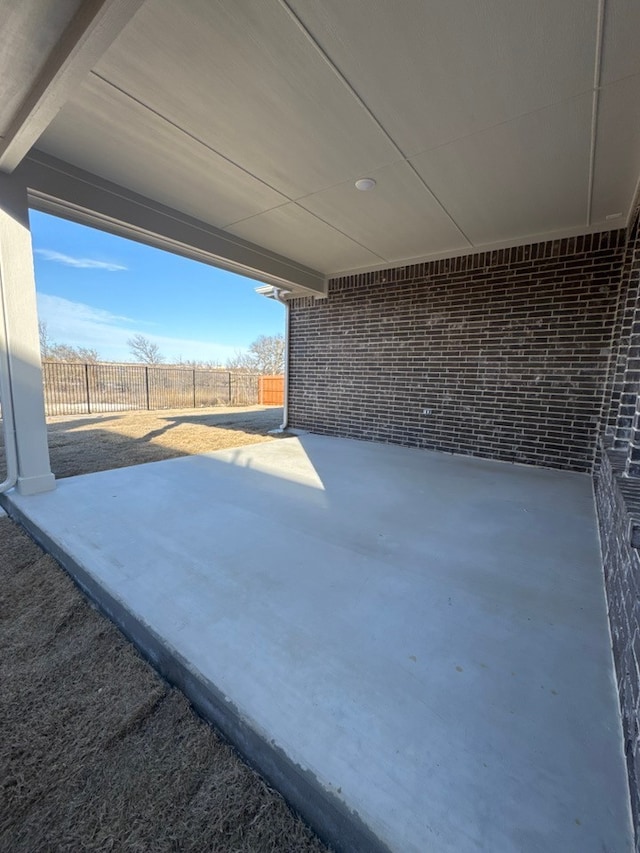 view of patio / terrace featuring fence