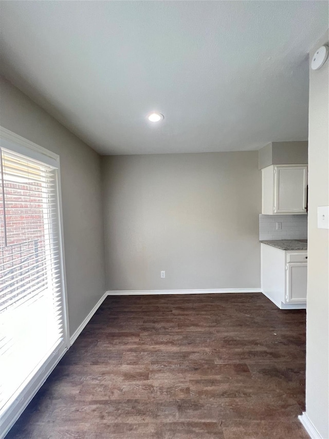 spare room featuring dark hardwood / wood-style floors