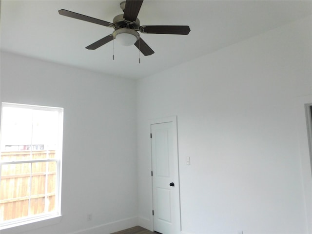 unfurnished room with ceiling fan and hardwood / wood-style floors