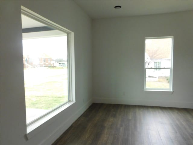 empty room featuring dark hardwood / wood-style floors