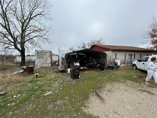 view of side of property with a carport