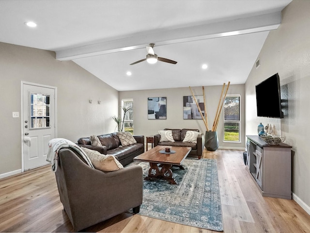 living room with vaulted ceiling with beams, light hardwood / wood-style floors, and ceiling fan