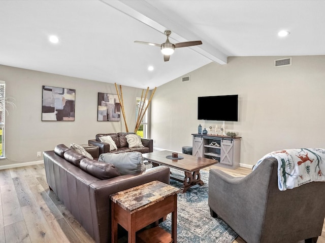 living room featuring ceiling fan, light hardwood / wood-style flooring, and lofted ceiling with beams