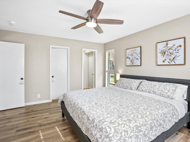 bedroom featuring wood-type flooring and ceiling fan