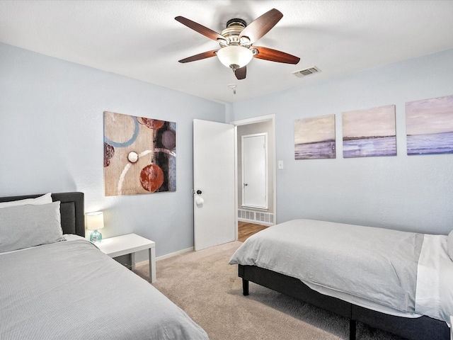 bedroom with ceiling fan and light colored carpet