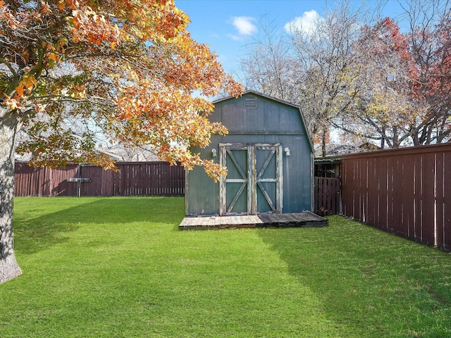 view of outdoor structure featuring a lawn