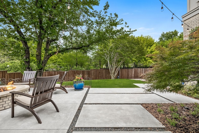 view of patio / terrace featuring an outdoor fire pit