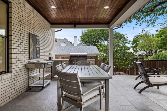 view of patio with area for grilling and grilling area