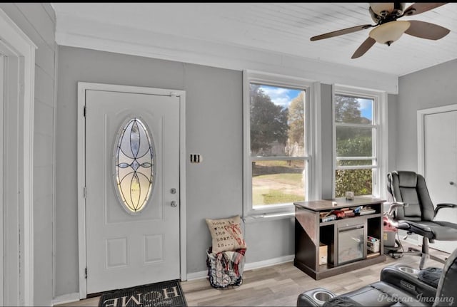 entrance foyer with ceiling fan and light hardwood / wood-style flooring