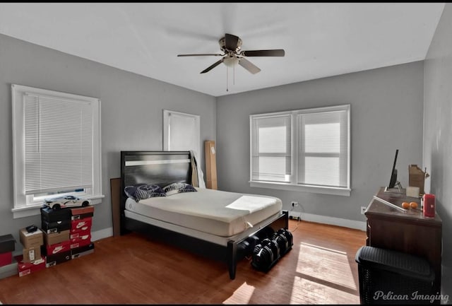 bedroom featuring ceiling fan and wood-type flooring