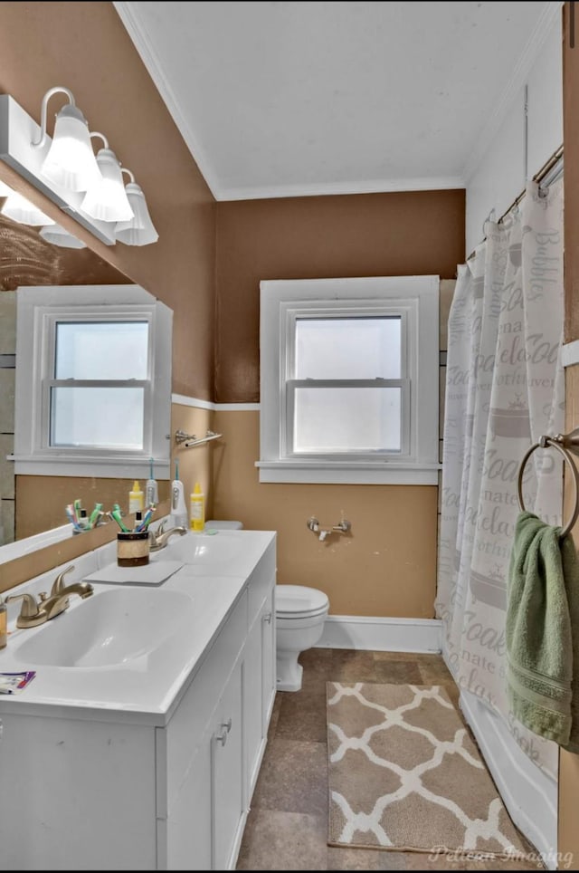 bathroom with a shower with shower curtain, vanity, toilet, and ornamental molding