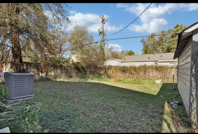 view of yard with central AC unit