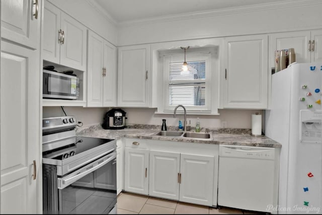 kitchen featuring white cabinets, stainless steel appliances, and sink