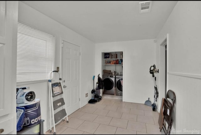 workout room with washer and clothes dryer