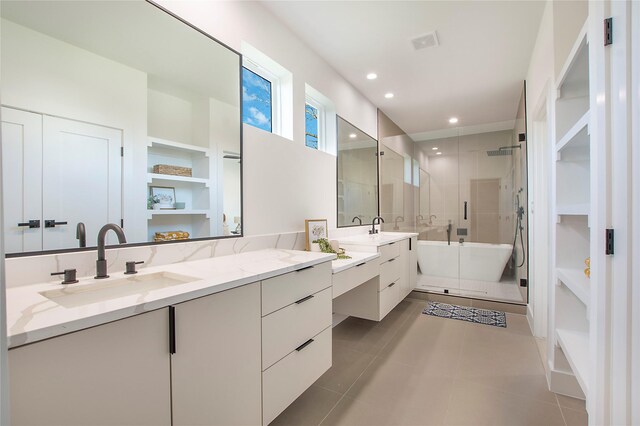 bathroom featuring separate shower and tub, tile patterned flooring, and vanity