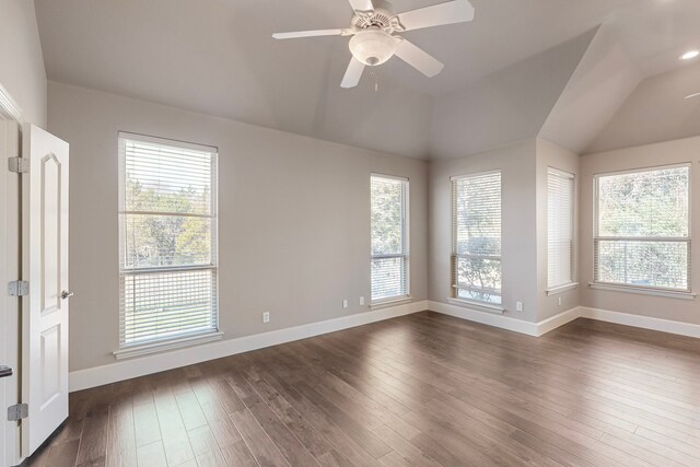 empty room featuring ceiling fan, plenty of natural light, and dark hardwood / wood-style floors