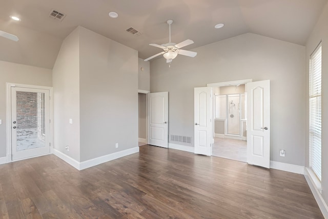 unfurnished bedroom featuring ceiling fan, dark hardwood / wood-style floors, access to exterior, and high vaulted ceiling