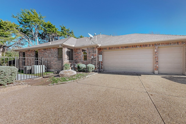 ranch-style home featuring a garage