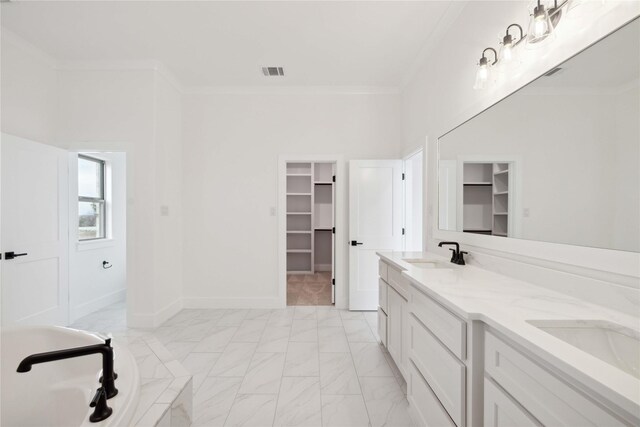 bathroom with vanity and crown molding