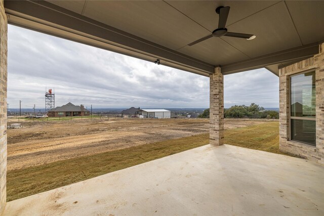 view of patio featuring ceiling fan