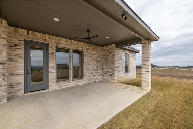 view of patio featuring ceiling fan