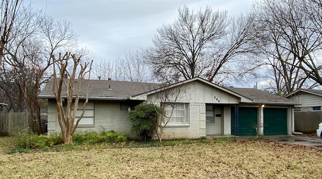 view of front of house featuring a garage and a front yard