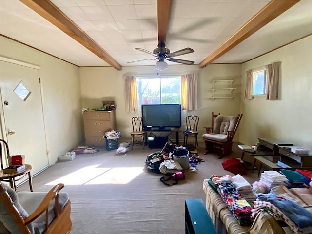 interior space with ceiling fan and beam ceiling