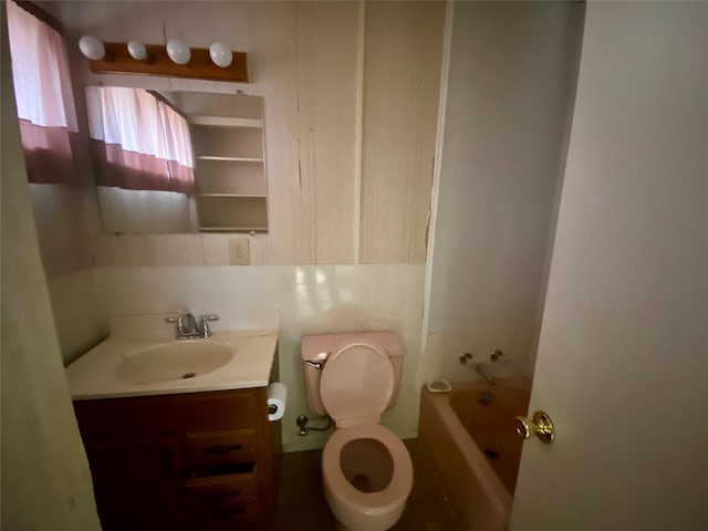 bathroom featuring toilet and vanity