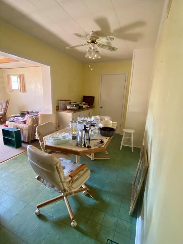 dining space featuring ceiling fan