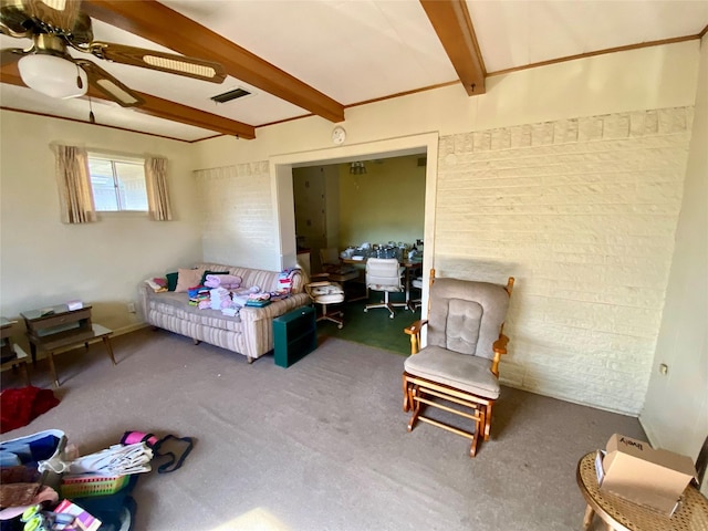 bedroom featuring ceiling fan, carpet, and beam ceiling