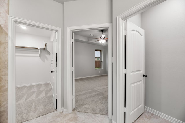 interior space with light colored carpet and baseboards