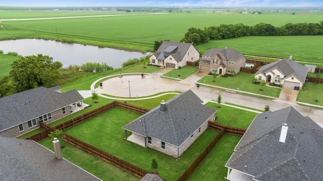 bird's eye view featuring a rural view and a water view