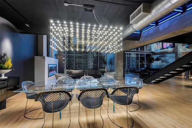 interior space featuring wood-type flooring and a chandelier