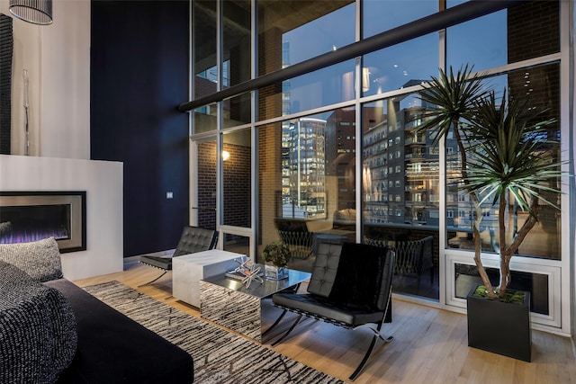 2011 Cedar Springs Rd Unit 606, Dallas, TX 75201 - view of patio featuring a glass covered fireplace and a city view
