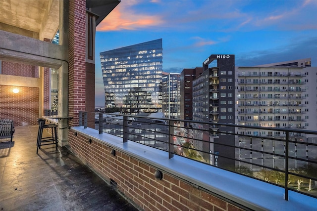 view of balcony at dusk