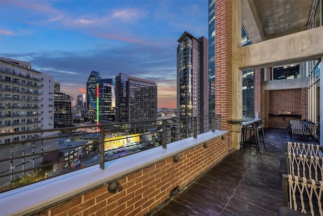 view of balcony at dusk