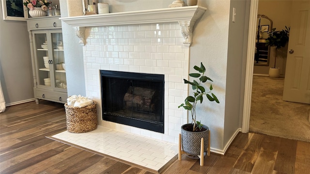 interior details with hardwood / wood-style flooring and a fireplace