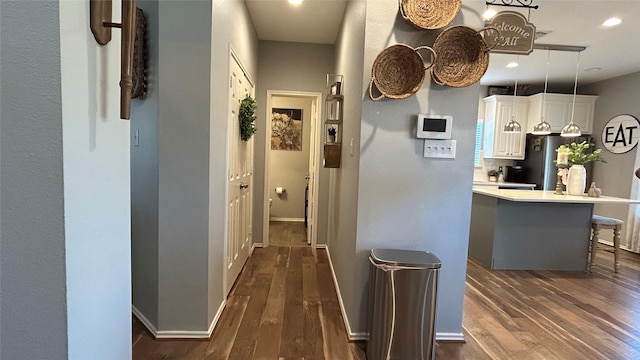 hall featuring dark wood-type flooring