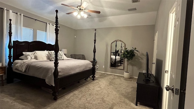 bedroom with vaulted ceiling, carpet flooring, and ceiling fan