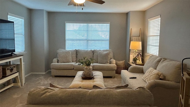 living room with ceiling fan and carpet floors