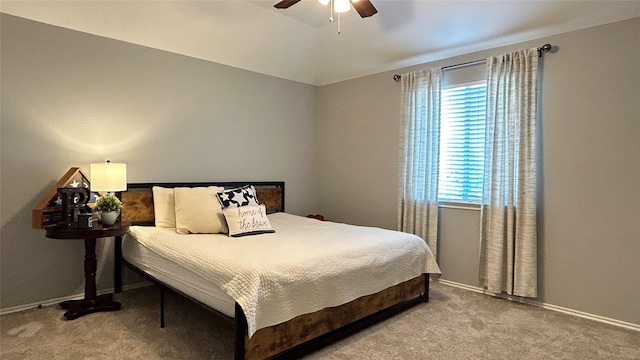 bedroom featuring ceiling fan, vaulted ceiling, and light carpet