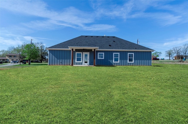 316 Clubview Dr, Bowie, TX 76230 - back of house with a yard, board and batten siding, and roof with shingles