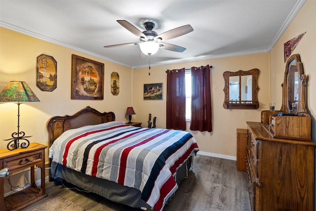 bedroom with dark hardwood / wood-style flooring, crown molding, and ceiling fan