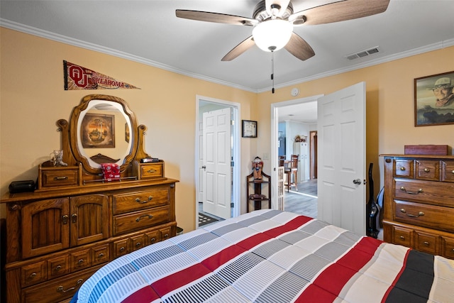 bedroom with ornamental molding and ceiling fan