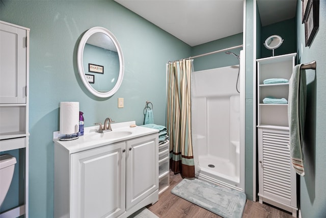 bathroom with vanity, hardwood / wood-style floors, and a shower with shower curtain