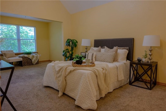 carpeted bedroom featuring vaulted ceiling