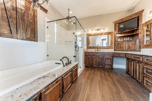 bathroom with vanity, plus walk in shower, and an inviting chandelier